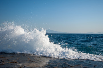 Waves hit the hard surface of concrete slabs