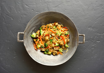 Udon stir-fry noodles with vegetables in wok