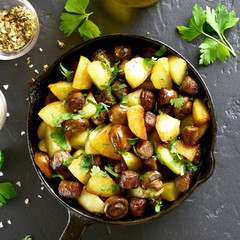 Fried potatoes with mushroom and sausage