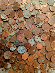 A pile of tarnished and partially corroded British copper coins - one and two pence pieces - and a lot of verdigris