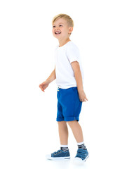 Emotional little boy in a pure white t-shirt.