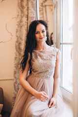 Fototapeta premium Tender elegant bride in wedding dress. Fashion beauty brunette girl preparing for a marriage