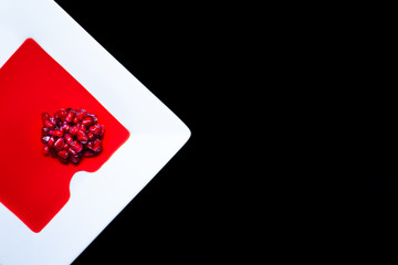 Pommegranate seeds on a plate with juice