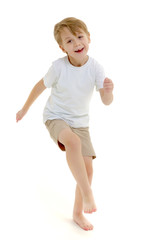 Emotional little boy in a pure white t-shirt.