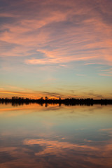 Beauty clouds after sunset reflecting in a calm lake