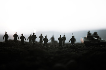War Concept. Military silhouettes fighting scene on war fog sky background, World War Soldiers...