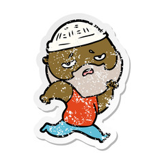 distressed sticker of a cartoon worried man with beard