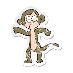 retro distressed sticker of a cartoon monkey