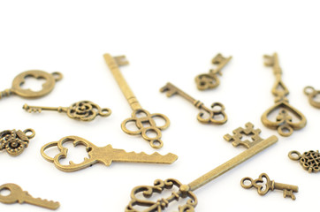 Decorative keys of different sizes, stylized antique on a white background. Form the centerpiece.