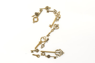 Decorative keys of different sizes, stylized antique on a white background. Form the centerpiece. Number two
