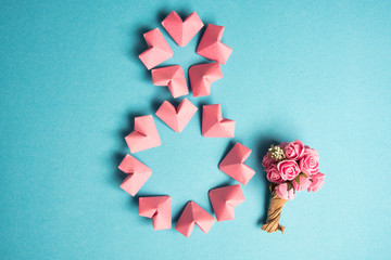 Happy International Women’s Day celebrate on March 8, congratulatory CARD. rose-color paper hearts shape figure eight 8