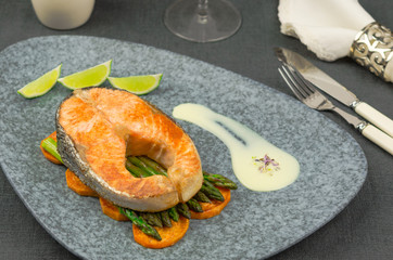  Baked salmon with sweet potato and green asparagus. Grilled salmon steak 