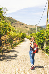 young woman traveler in vineyards