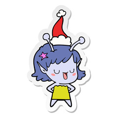 happy alien girl sticker cartoon of a wearing santa hat