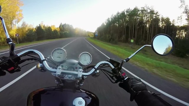 Amazing motorcycle riding towards sunset. Classic cruiser/chopper forever! 