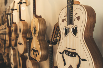 different portuguese guitars on wall different portuguese guitars on wall