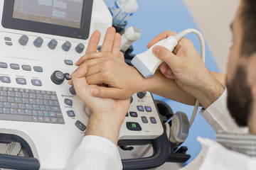 Close up shot of a woman getting wrist ultrasound scanning