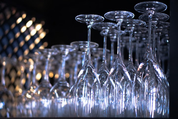 Empty champagne glasses, wines of different drinks.
