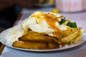 Cuban style rice with egg, french fries, plantain and rice