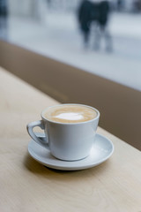 cup of coffee on table in cafe