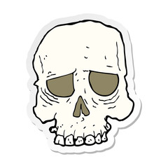 sticker of a cartoon spooky skull