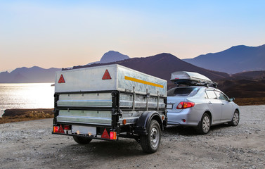 Car trailer by the sea