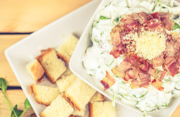 Fresh salad with cheese and pancetta