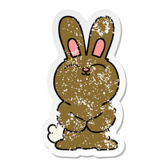 distressed sticker of a quirky hand drawn cartoon rabbit