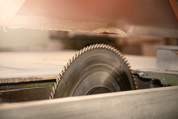 Circular metal saw. Wood carpentry workshop. Carpenter shop.