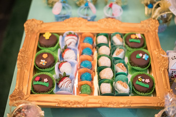 Sweets and decoration on the table - Children's birthday garden theme