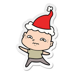 sticker cartoon of a nervous man wearing santa hat
