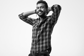 Fashionable brutal young African American male hipster in studio