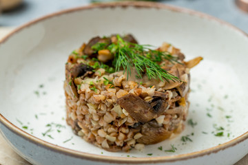 Fried buckwheat porridge with onions and mushrooms