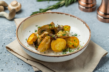 Fried potatoes with mushrooms