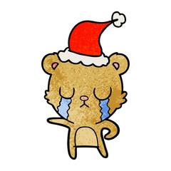 crying textured cartoon of a bear wearing santa hat