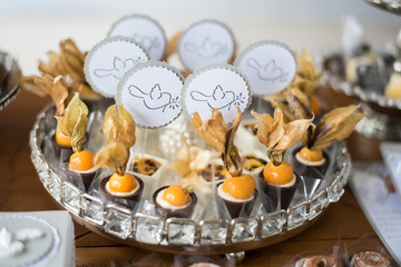 Sweets and decoration on the table - Baptism theme