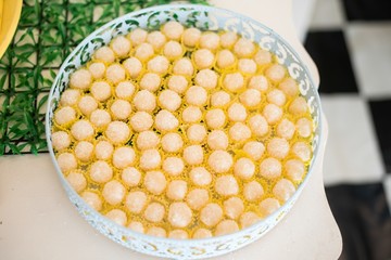 Several sweets in the tray on the table