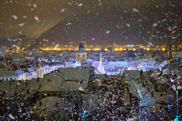 Brasov, Transylvania. Romania. Panoramic view of the old town and Council Square in the winter...