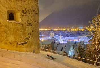 Brasov, Transylvania. Romania. Panoramic view of the old town and Council Square in the winter...