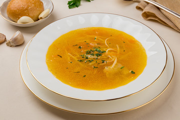 Chicken soup bouillon in a plate