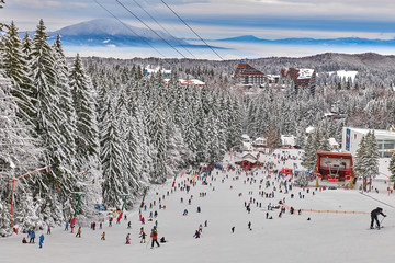 Poiana Brasov, Romania -16 January 2019: Skiers and snowboarders enjoy the ski slopes in Poiana...