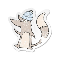retro distressed sticker of a cartoon little wolf