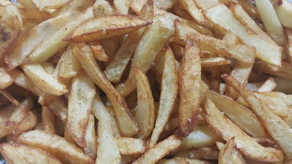 Closeup view of potato french fries or roasted potato sticks