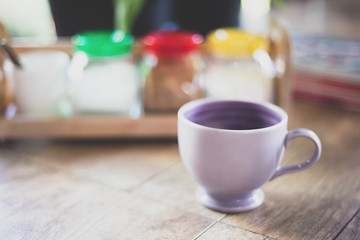 cup of coffee on wooden table