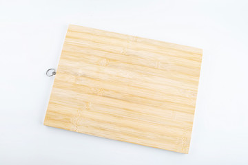 a bamboo chopping board on a white background