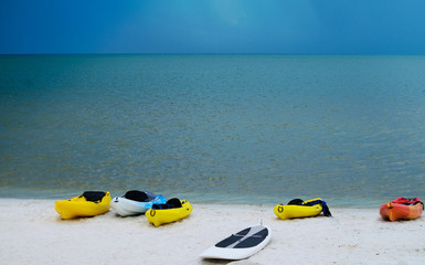 Kayaks  on a beach after storm warning