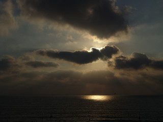 Cloudy sunset over a sandy beach ocean