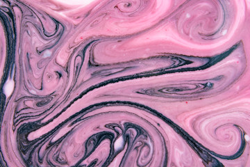 Abstract beautiful pattern of pink and black marble.The Eastern style of Ebru painting on water with acrylic paints swirls marbling.A stylish mix of colors,genuine luxury 