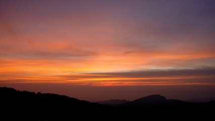 Sunset mountain peaks sky. Mountain peaks sunset view.