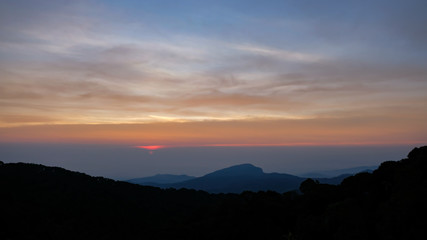 Sunset mountain peaks sky. Mountain peaks sunset view.